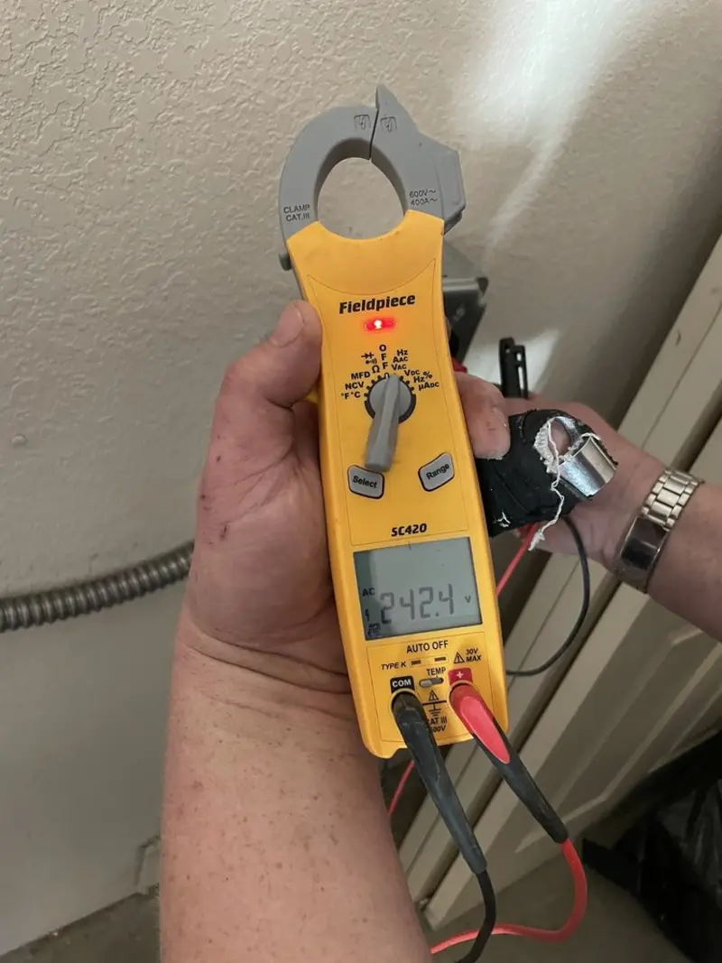 Voltage testing with clamp meter during Outlet Installation in Lake Park